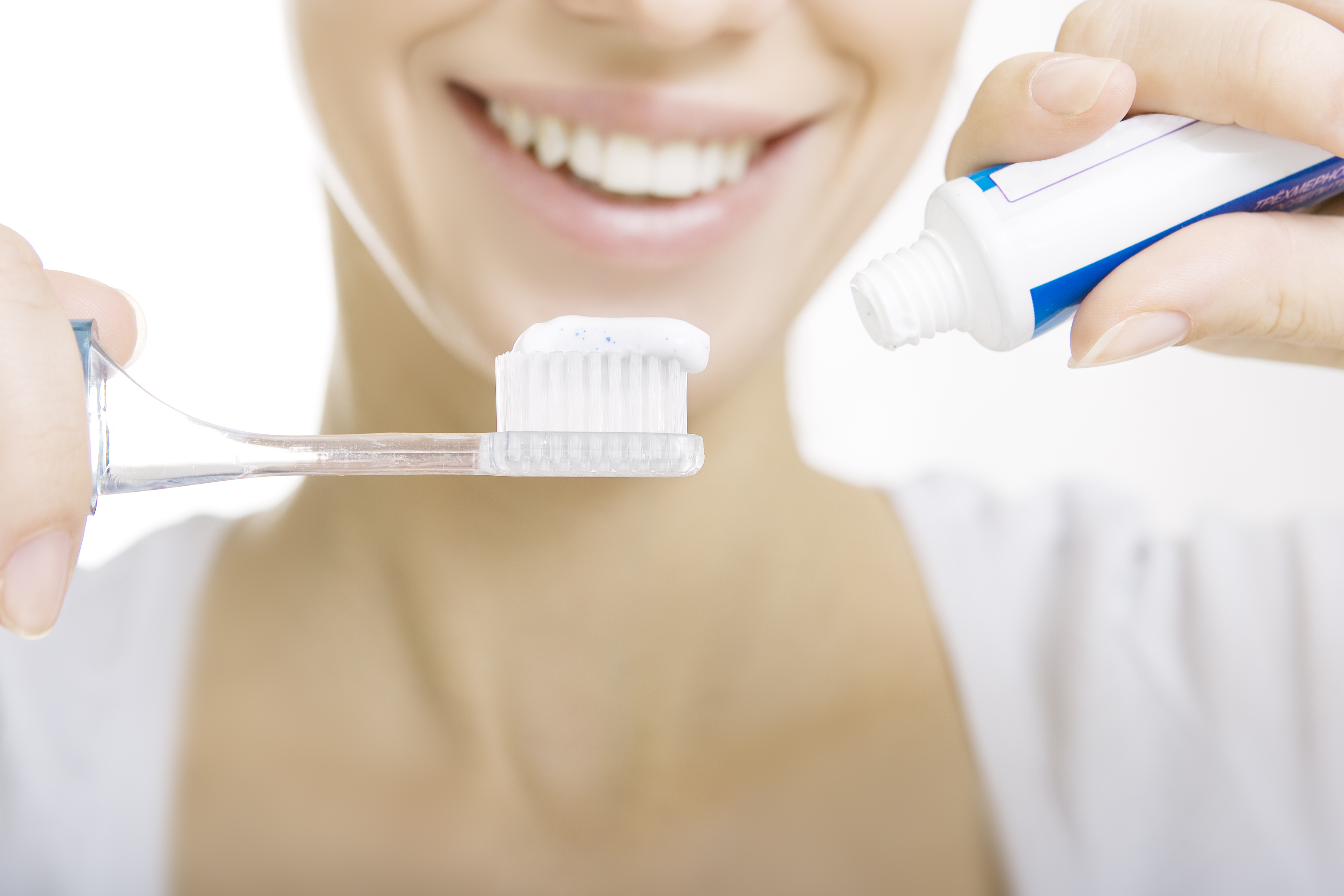 Closeup girl with toothbrush cleaning teeth at home, dental care and whiten toothpaste